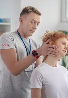 a2z chiropractic male physiotherapist examining head of female patient