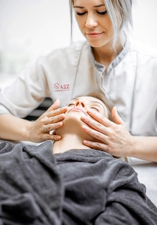 a2z chiropractic woman during the facial massage at the clinic